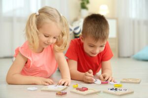 Child plays with farm toy wooden puzzle from MERLE TOYS®